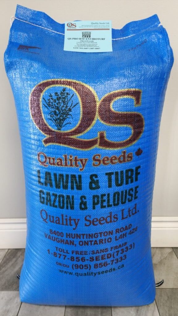 A blue bag of Quality Seeds for lawn and turf with company details printed, including address in Vaughan, Ontario, and contact information.